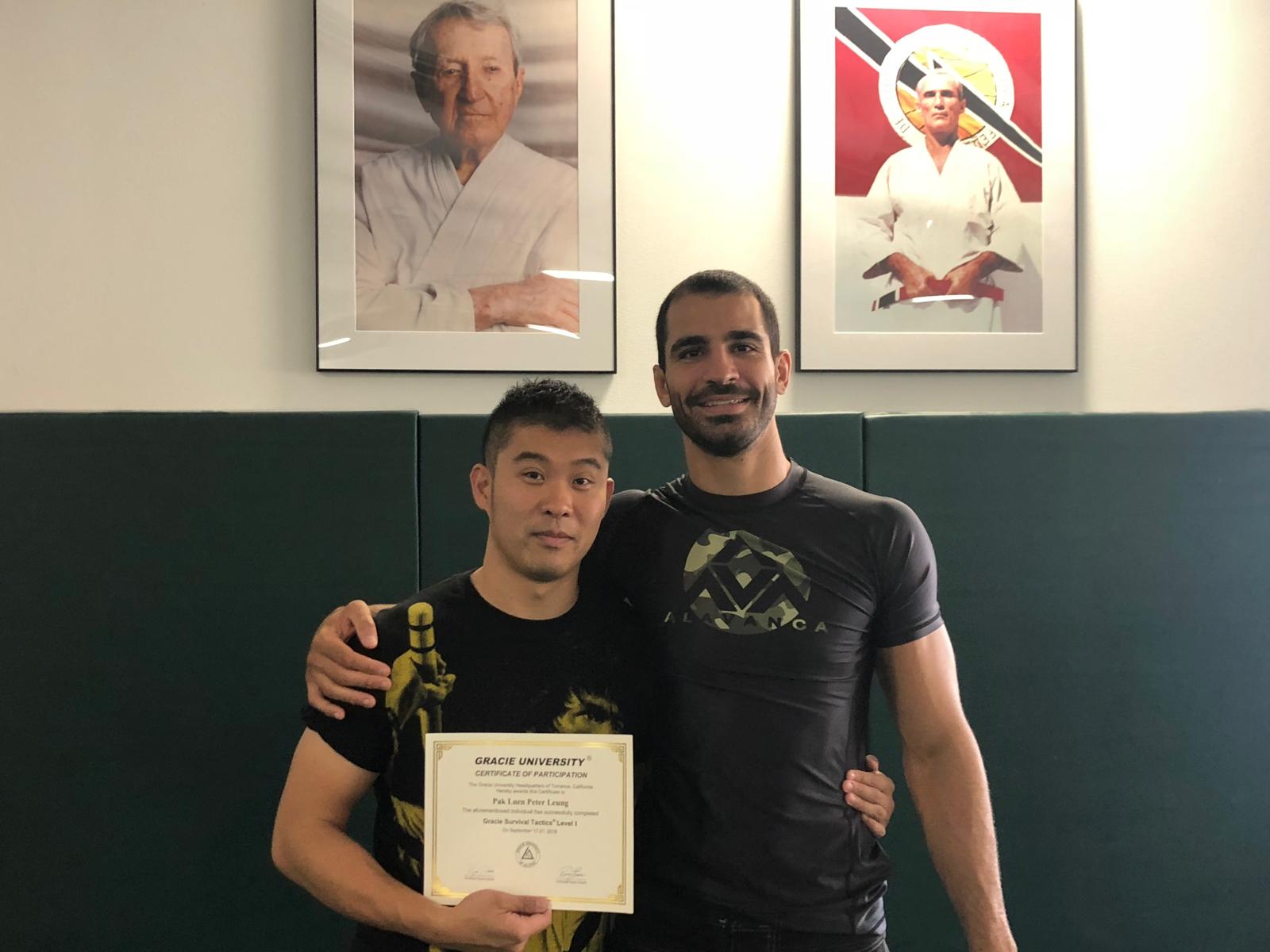Peter Leung receiving his Gracie Survival Tactics certificate