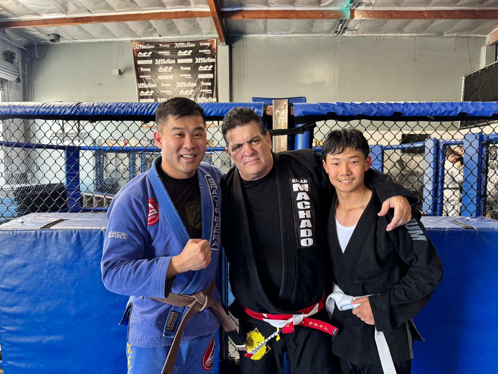 Peter Leung and Austin with Master Rigan Machado at the 2025 CSW Seminar